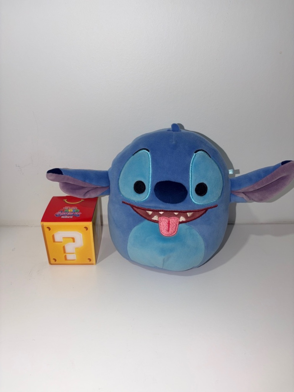 Squishmallows Disney Stitch Plush with a silly face and tongue out 7 inch